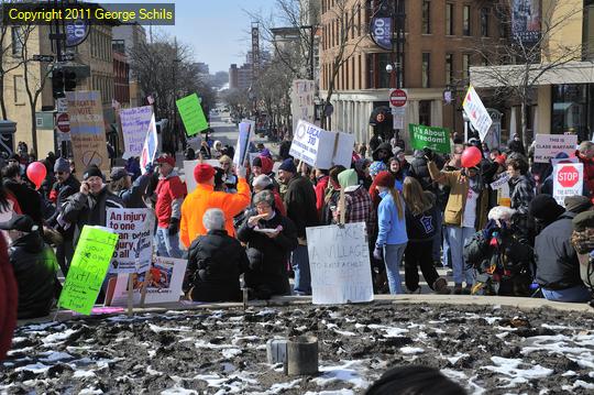 Protesters are seen with State Street in the background. On the previous Saturdays, the entire State Street in the background was filled with protesters.