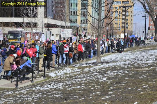 People are lined up down the square.